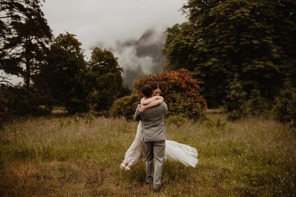 A couple hugging each other at their elopement location in Washington state.