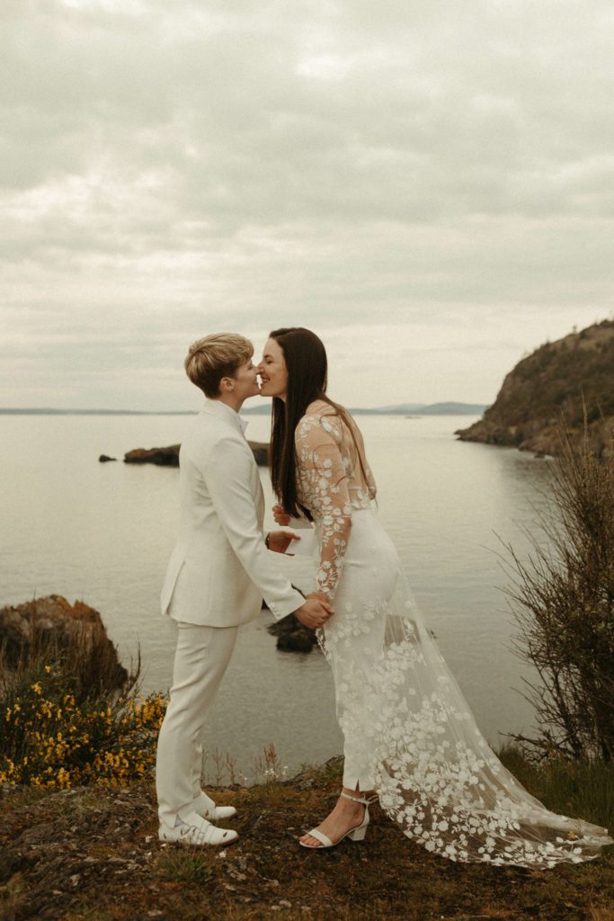 A couple kissing after their vow renewal at Deception Pass.