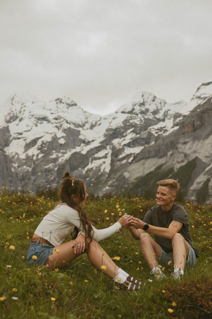 Couple in a field in the Swiss Alps 