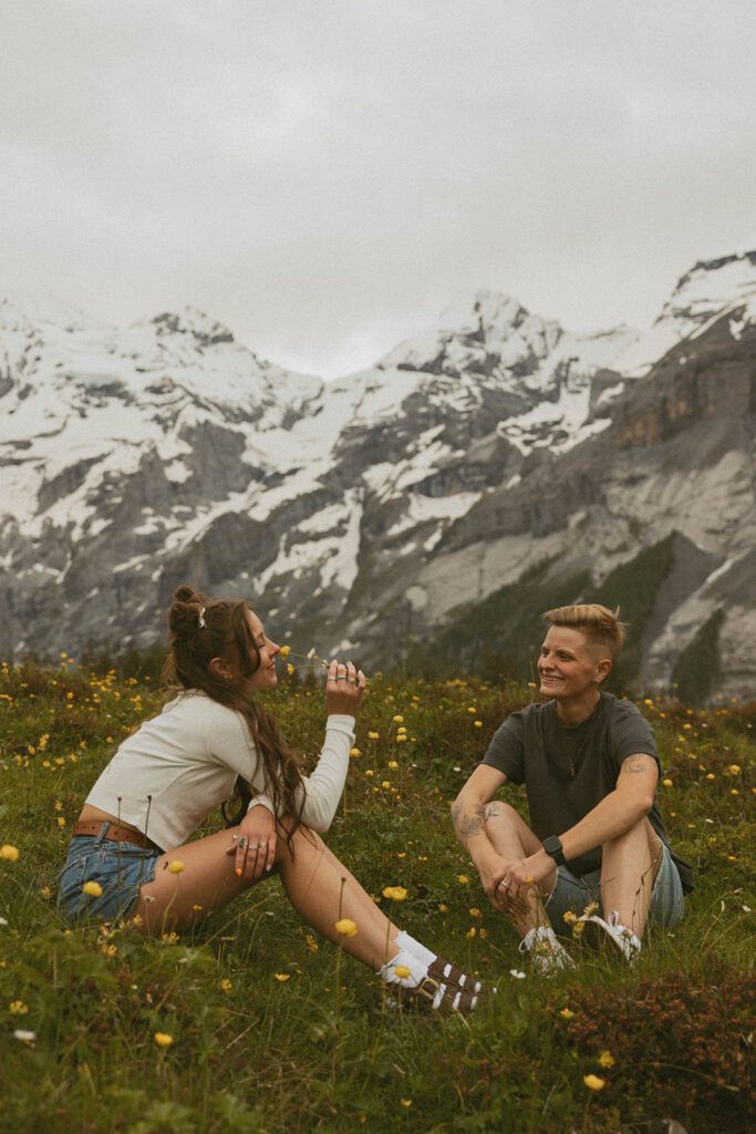 Couple in a field in the Swiss Alps 